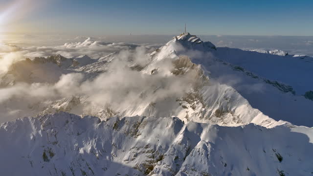 Aerial View of the Mountain Santis in the Swiss Alps, Switzerland. Seantis Weather Station, View Platform at sunset.