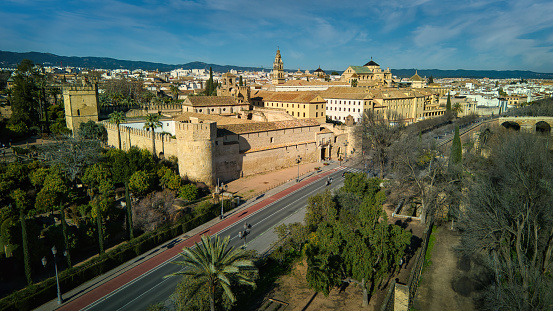 View over Cordoba. Mezquita-Cathedral de Cordoba, Alcázar de los Reyes, Puente Romano Roman Bridge, Guadalquivir River and Old Town. Andalusia, Spain.