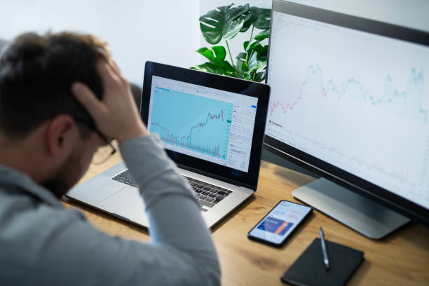 istock Tired trader at his home office. 1960427008