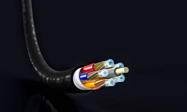 istock black fibre optic cable on a dark background. 1960438196