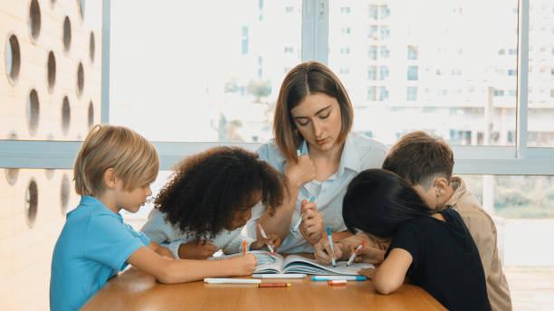 istock Professional caucasian teacher telling story to diverse student. Erudition. 1960489663