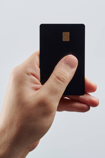 istock Hand hold black bank plastic card 1960521162