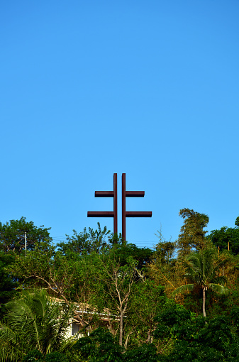 Nouméa, South Province, Grande Terre, New Caledonia: erected at the summit of Mount Coffyn, the Cross of Lorraine dominates Nouméa. It recalls the role played by the Pacific Battalion in the battles led by Free France, founded by General de Gaulle, during the Second World War. The Cross of Lorraine is a double cross. In heraldry, it is called the archiepiscopal cross or patriarchal cross. This cross figured in the emblem of the Dukes of Anjou who became Dukes of Lorraine from 1431.