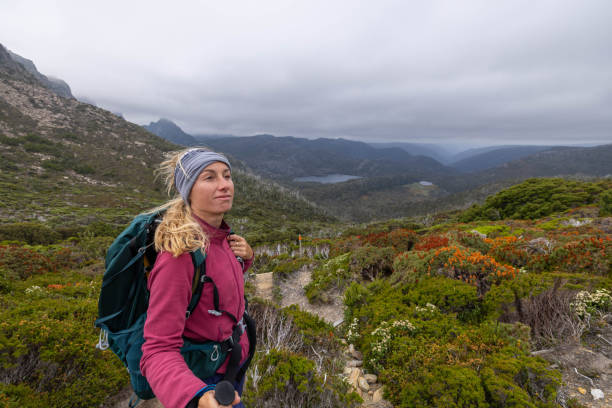 istock Mountain Ascent: Woman Hiking with Stormy Sky 1960551903