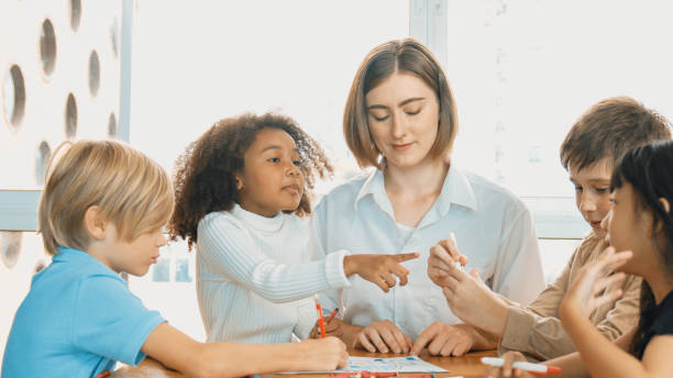 istock Professional caucasian teacher telling story to diverse student. Erudition. 1960560548