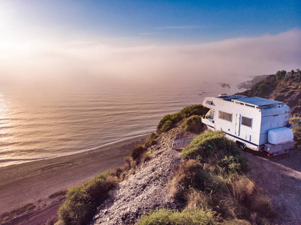 istock Caravan camping on misty coast, Spain. 1960562153