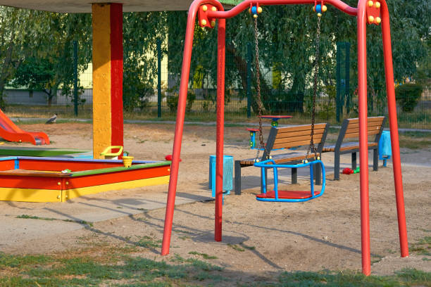 istock Summer spring children's playground with painted toy slide in park 1960602789