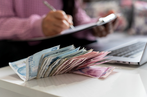 Businesswoman counting Turkish money. photo