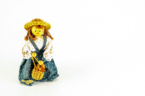 Photo of Pierrot toy doll on white background