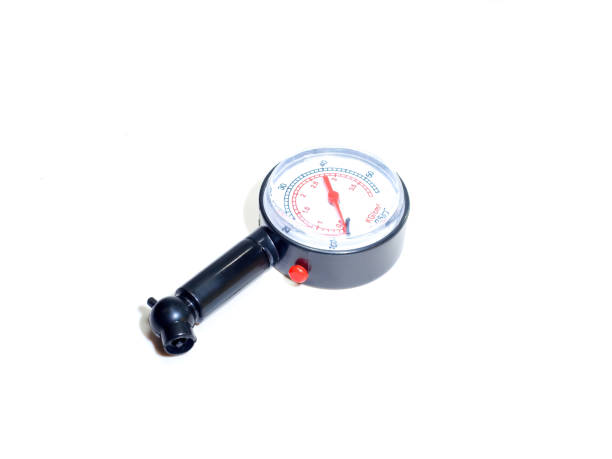 istock closeup Tire Pressure Gauge isolated on white background 1960680864