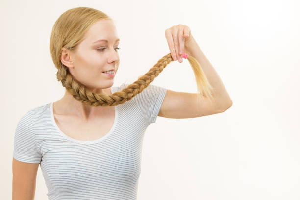 istock Blonde young woman with braid hair 1960700438