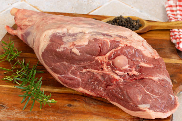 istock raw leg of lamb, close-up, on a cutting board 1960719299