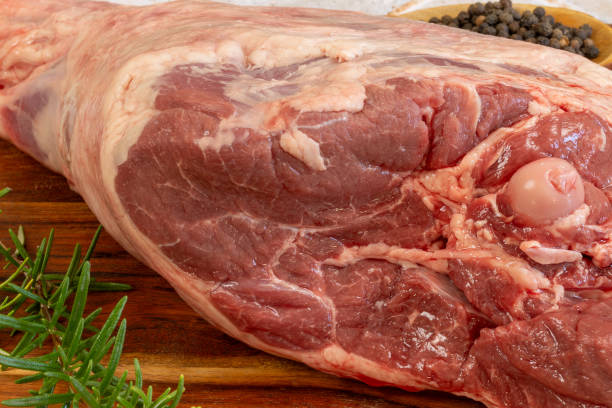 istock raw leg of lamb, close-up, on a cutting board 1960719818