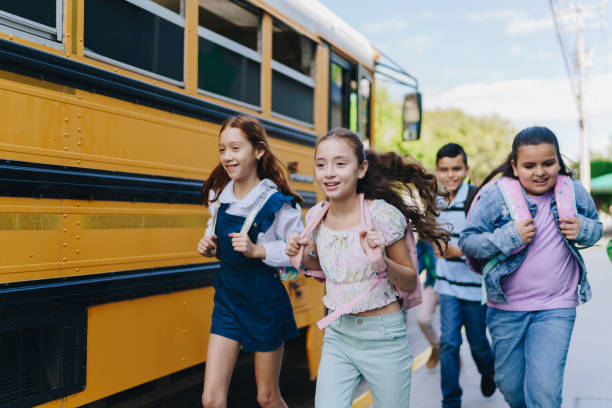 istock Child students running outside the school 1960721887