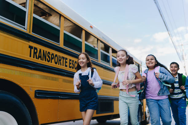 istock Child students running outside the school 1960721891
