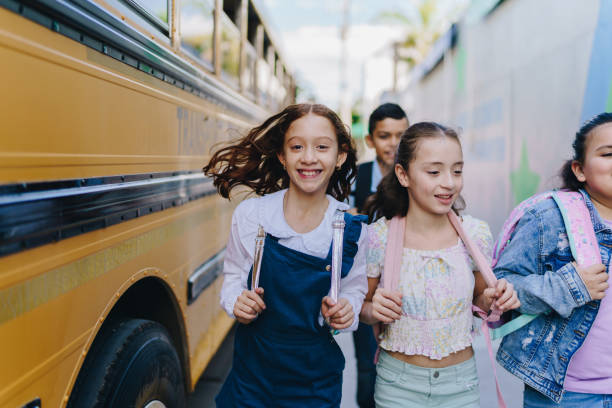 istock Child students running outside the school 1960721896