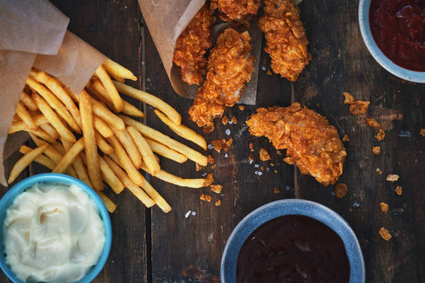 istock Crispy Fried Chicken Drumsticks with French Fries 1960737042