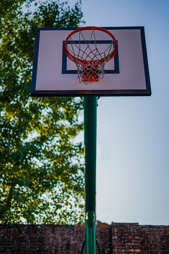 basketball hoop in a park on a sunny day