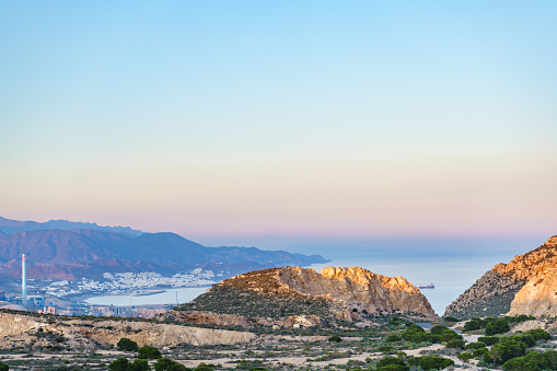 View from Mesa Roldan of Carboneras town with cement factory chimney, Cabo de Gata Nijar, coast Almeria, Spain.