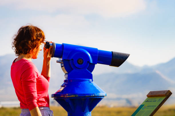 istock Woman using tourist binoculars, Cabo de Gata, Spain 1960785637