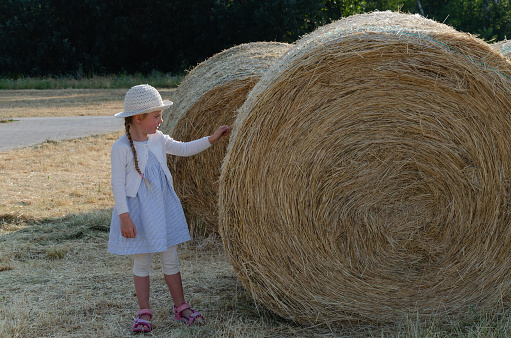 Mid adult woman and boy enjoyng freedom in the wheat field on a summer day