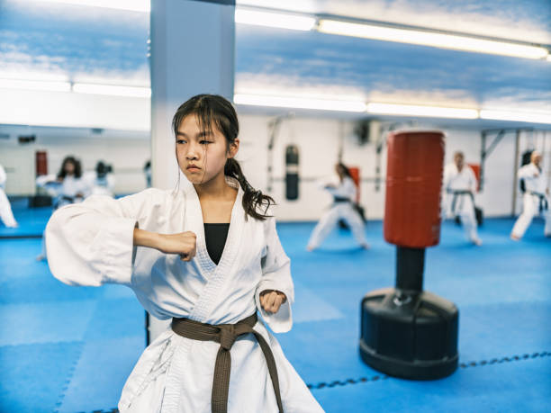 istock Young Karate fighters in karate school 1960871767