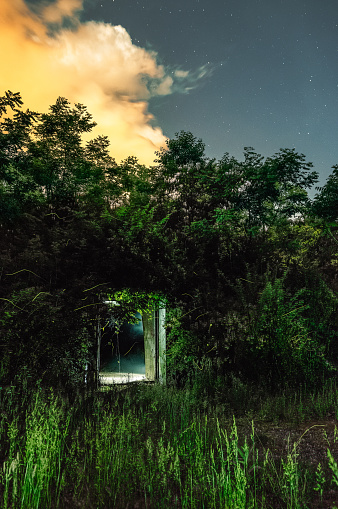 When night descends, fireflies surround one of the old World War II munitions storage bunkers, termed igloo's by the locals, found at the McClintock Wildlife Management Area (TNT area) near Point Pleasant, WV.
