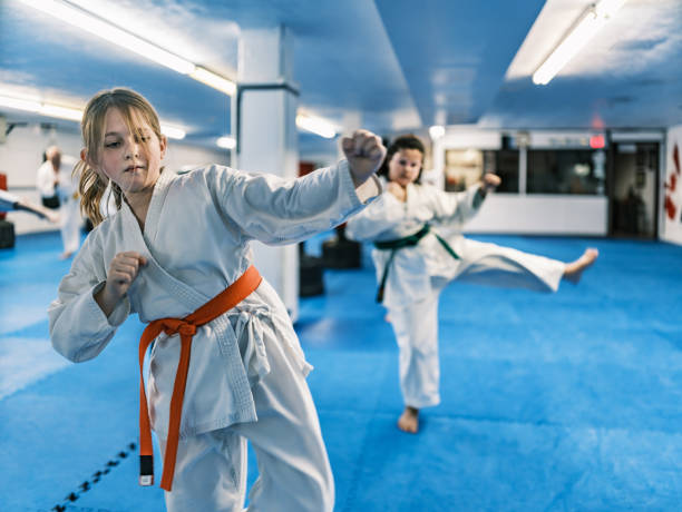 istock Young Karate fighters in karate school 1960912177