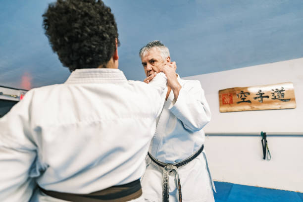 istock Sensei teaching Young Karate fighters in karate school 1960915345