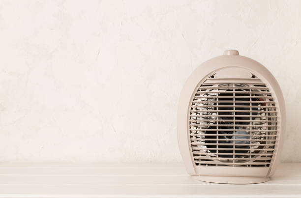 istock Portable electric heater on table 1960926398