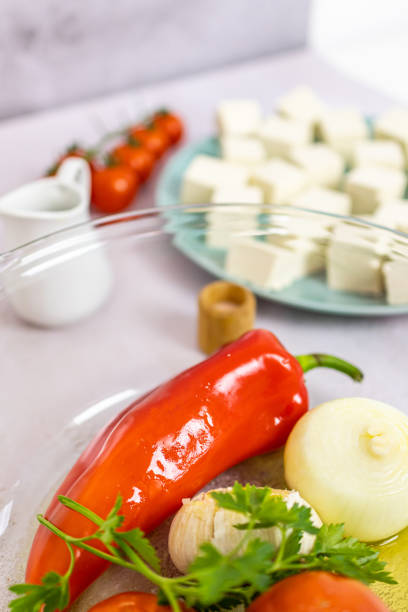 Vegetarian cheese. Organic raw tofu cubes with cherry tomatoes.