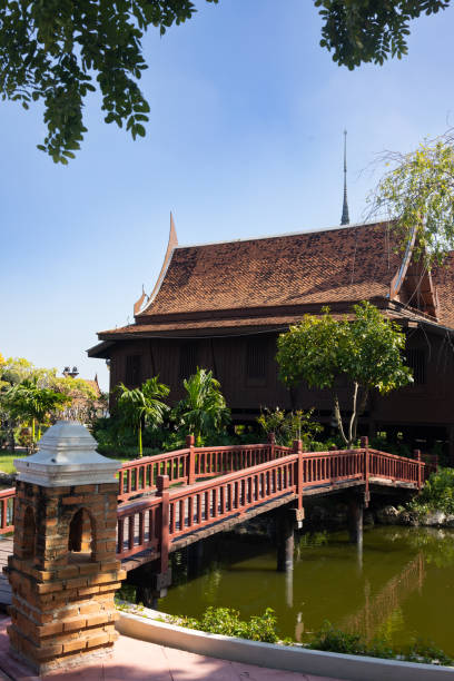 istock Wooden Bridge Over Pond in Front of Building 1960951041