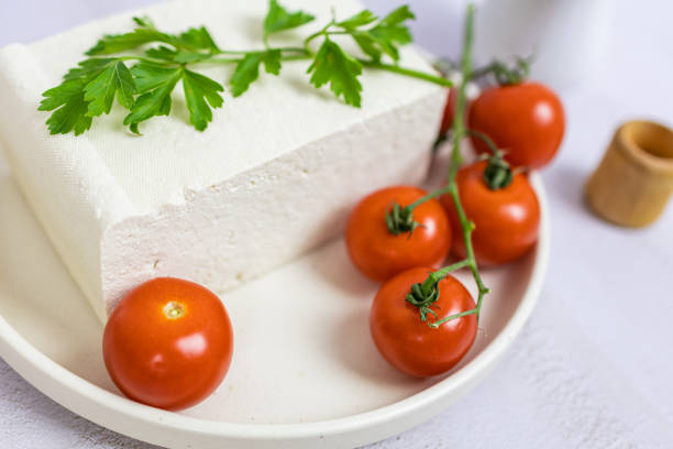 Vegetarian cheese. Organic raw tofu cubes with cherry tomatoes.