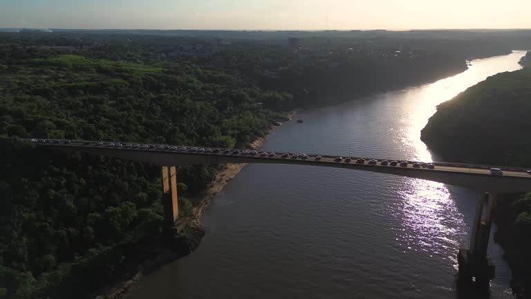 Cars in a traffic jam on a bridge that crosses the river