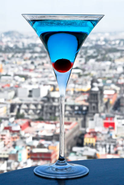 blue curacao martini cocktail with cherry - liqueur color image isolated nobody ストックフォトと画像