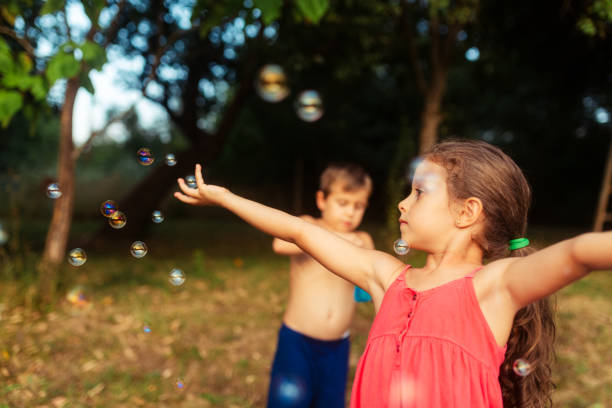 Girl blowing soap bubbles