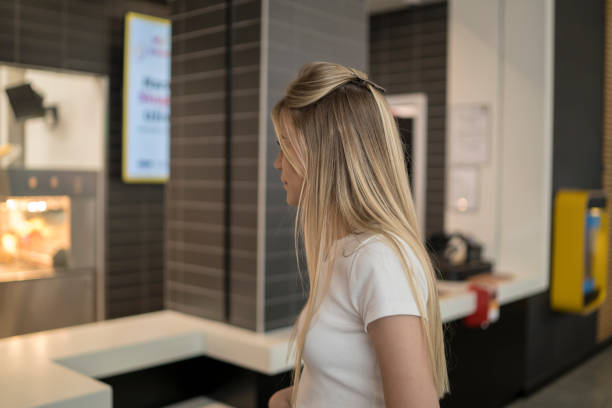 Young woman orders food for lunch