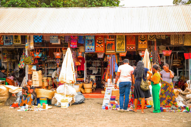 African wooden Masks, beaded decorations and souvenirs Arusha,Tanzania, Africa.02 february 2022. African masks, beaded bracelets, necklaces, Tanzanian national clothes, bags woven from natural material displayed and ready for sale. Calendars and tourism arusha region stock pictures, royalty-free photos & images