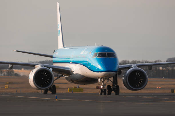KLM (KLM Cityhopper) Embraer E195-E2 REG:PH-NXE at Vaclav Havel Airport Prague PRAGUE - December 27, 2023: KLM (KLM Cityhopper) Embraer E195-E2 REG:PH-NXE at Vaclav Havel Airport Prague. From Amsterdam to Prague. KLM is the flag carrier of the Netherlands. embraer 195 stock pictures, royalty-free photos & images