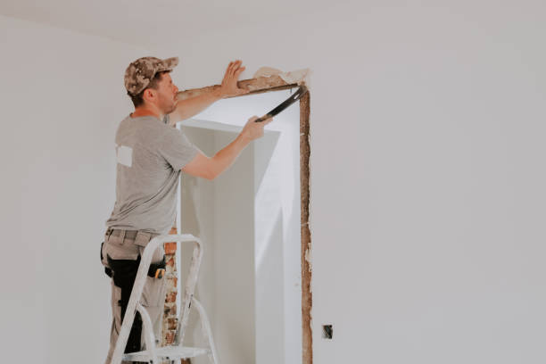 istock A young Caucasian male builder clears a doorway using a crowbar. 1961033983