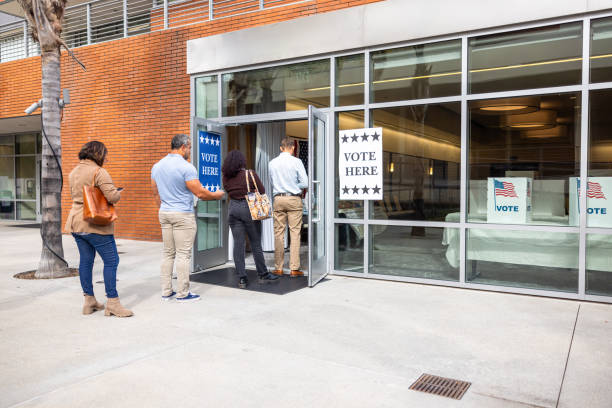 istock Americans waiting in line to vote in the election 1961055005