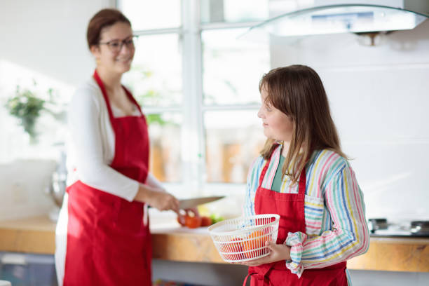 istock Mother and child cook. Mom and kid in kitchen 1961057593