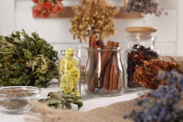 istock Many different dry herbs and flowers on white table 1961063410