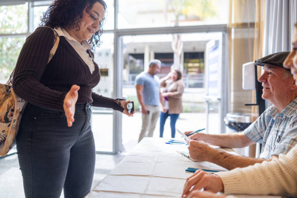 istock Americans checking in to vote at the election 1961063413