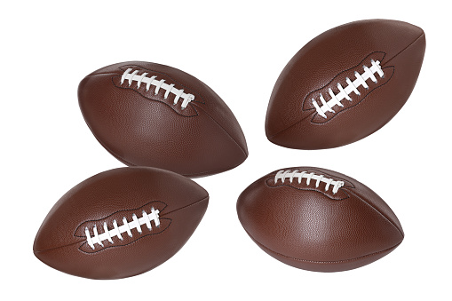 Many American football balls flying on white background