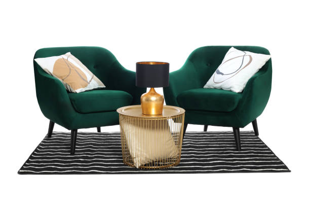istock Stylish comfortable armchairs, coffee table with lamp and striped rug isolated on white 1961073958