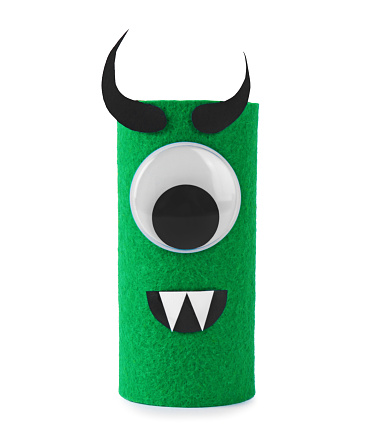 Monster made of green felt isolated on white. Halloween decoration