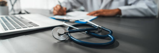 istock Focus stethoscope on doctor office with blurred background. Neoteric 1961101092