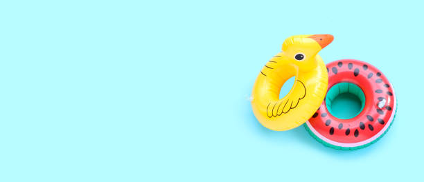 istock Inflatable rings on blue background. 1961139282