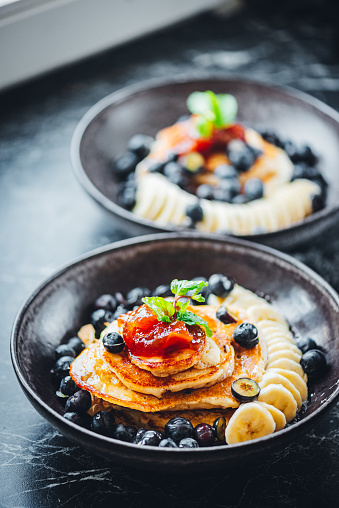 Vegan Breakfast Pancakes with Maple Syrup, Jam and Berries